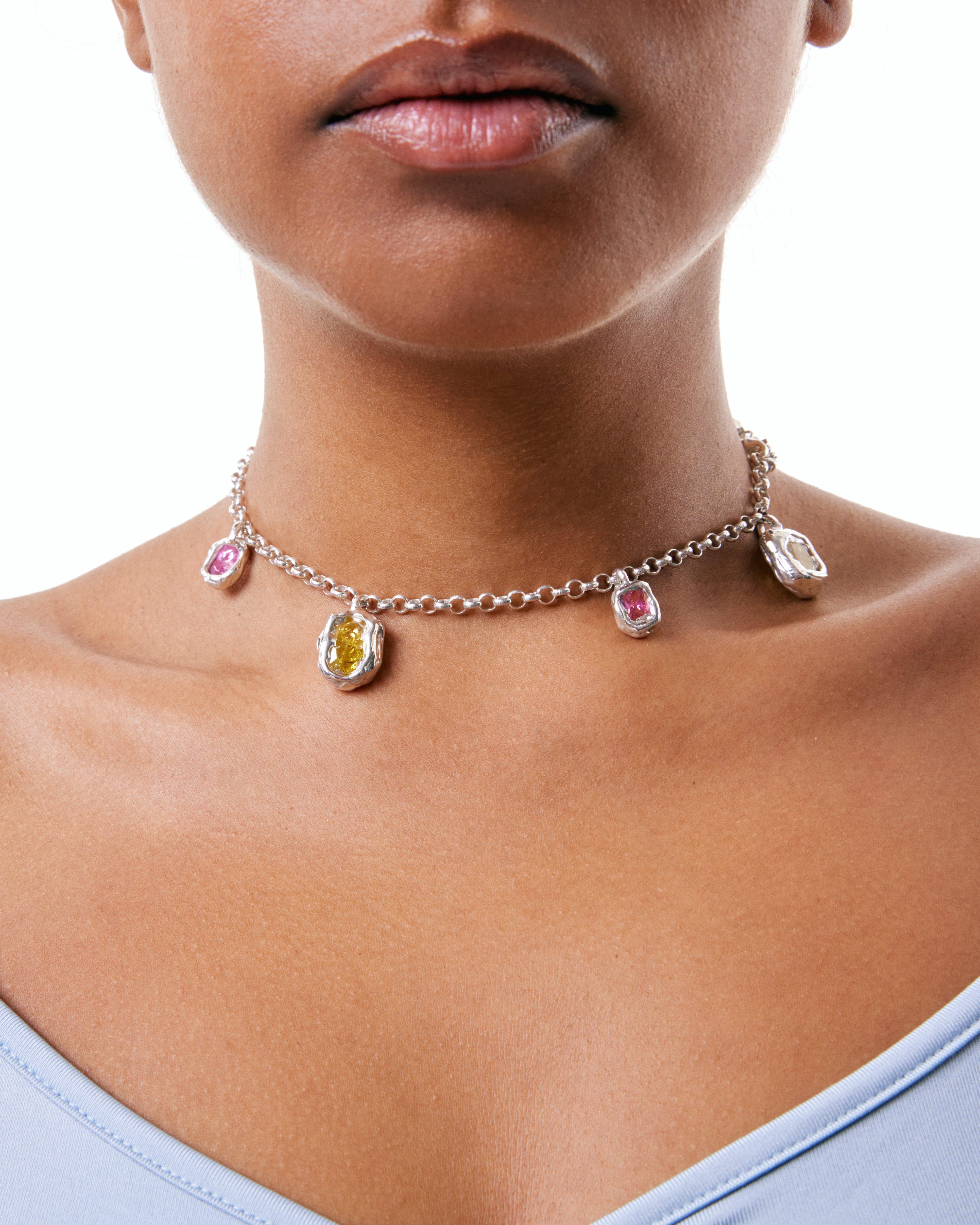 Silver chain with 4 zircons pendant in pink and yellow. The materials are 80% Sterling silver, 20% Zircon. Individually handcrafted in Spain, this piece is all about uniqueness and colour.

This necklace is 40cm long.

This piece is part of Rigido's
