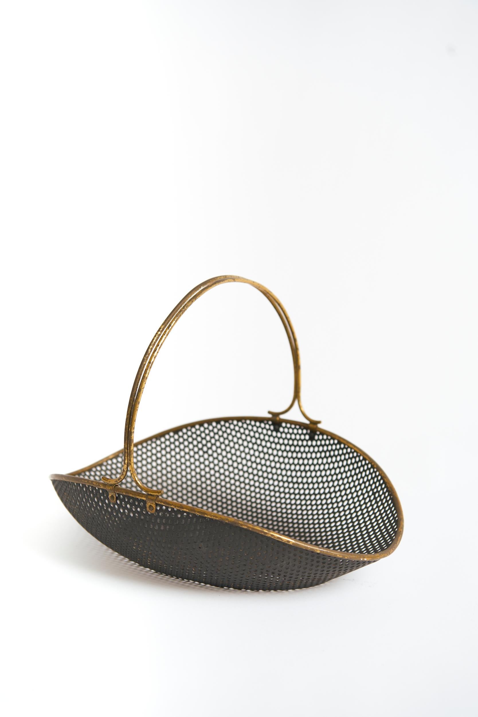 A brass mounted black rigitule basket, probably by Mathieu Mategot
France, 1950s
