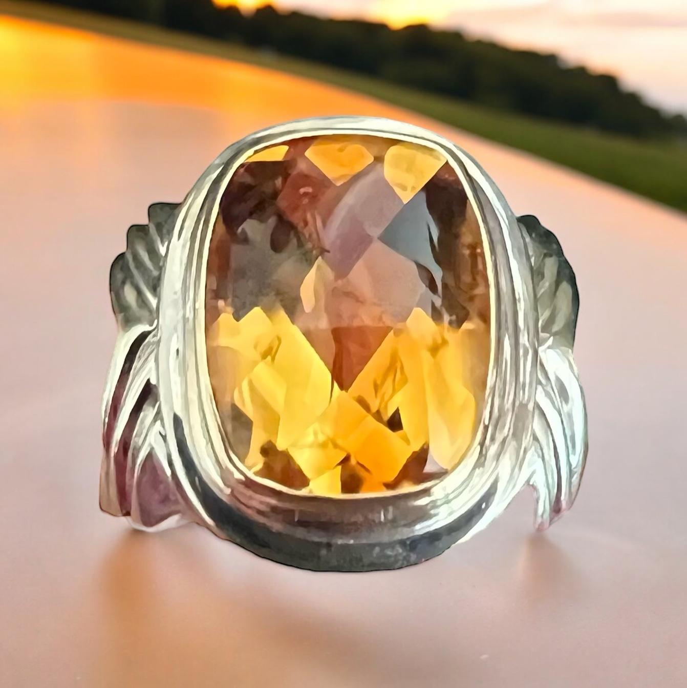 Rigoberto Citrine Silver and Gold ring.

 A buff top Citrine is bezel set in this bold silver and gold Rigoberto ring.  It is a classic that makes a statement.

SPECIFICATIONS:

CITRINE:  A buff top cushion cut Citrine weighing approximately 9