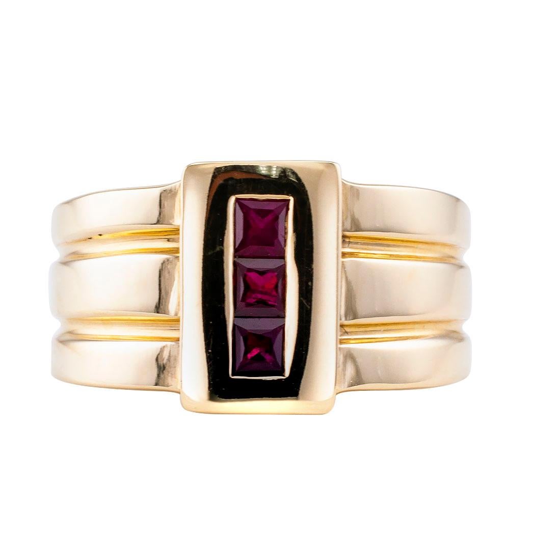 Ruby and gold gentleman’s ring band by Rigoberto. Designed as a wide tapering ring band set on the top with three calibrated rubies to the fluted shank, mounted in 14-karat yellow gold, signed Rigoberto inside shank. We love the streamlined elegance