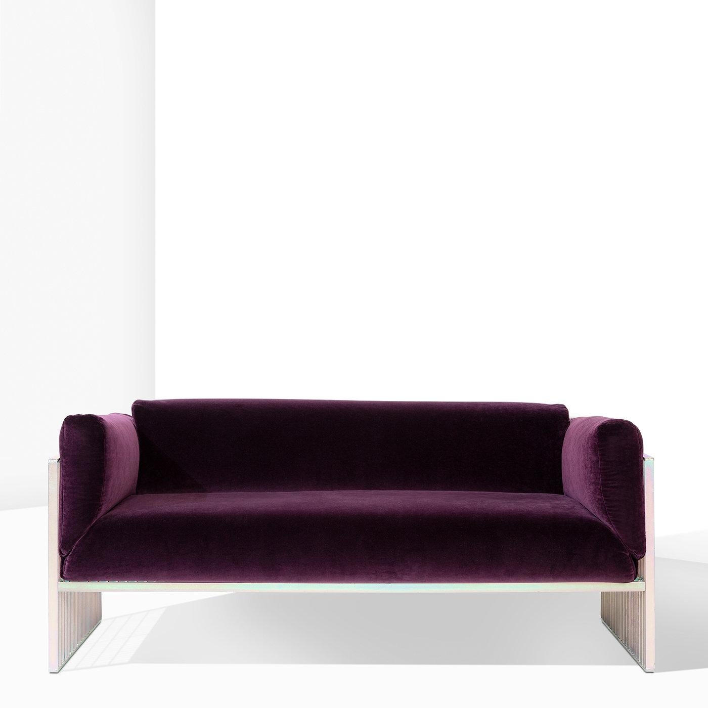 This statement-making sofa from the Bacchetta Capsule Collection is the perfect synthesis of industrial-inspired style and comfort. Enveloped in soft plum velvet, the voluptuous seat is set in a rigorous, grid-like iron frame boasting a charming