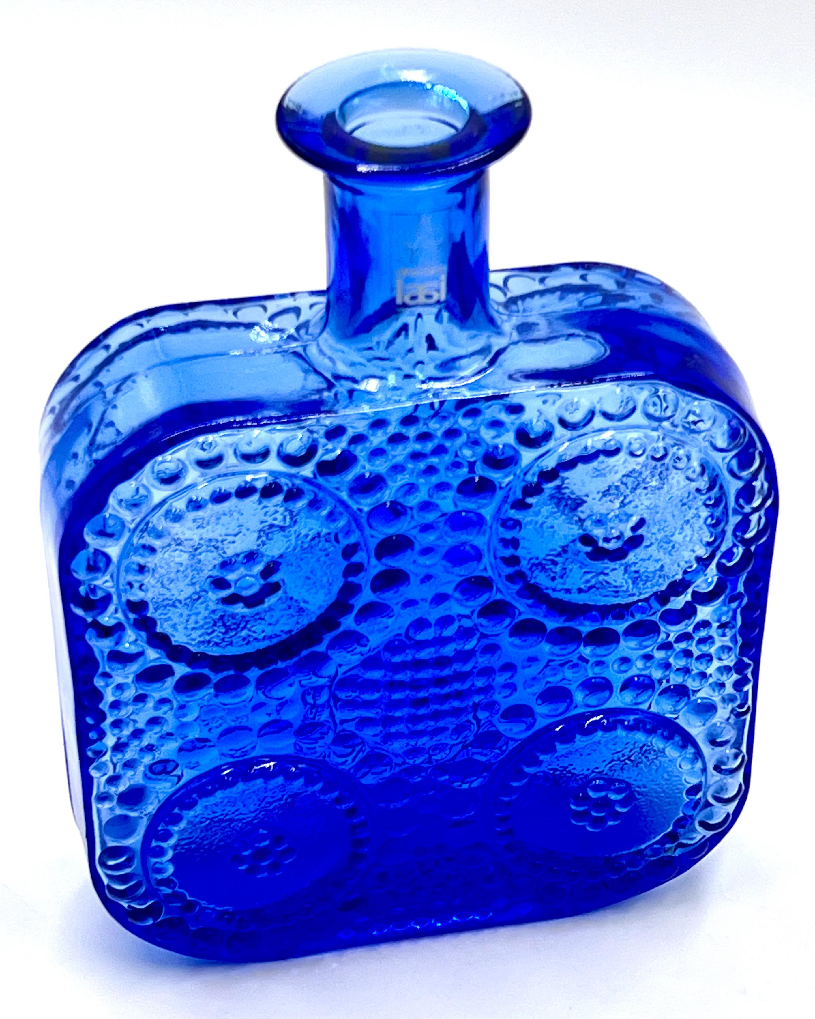 The Riihimaki glassworks was founded in 1910, in the town of Riihimaki, Finland, by M. A. Kolehmainen and his son A. P. Kolehmainen. At first they made domestic glass and container glass, and began making glass bottles and window glass in