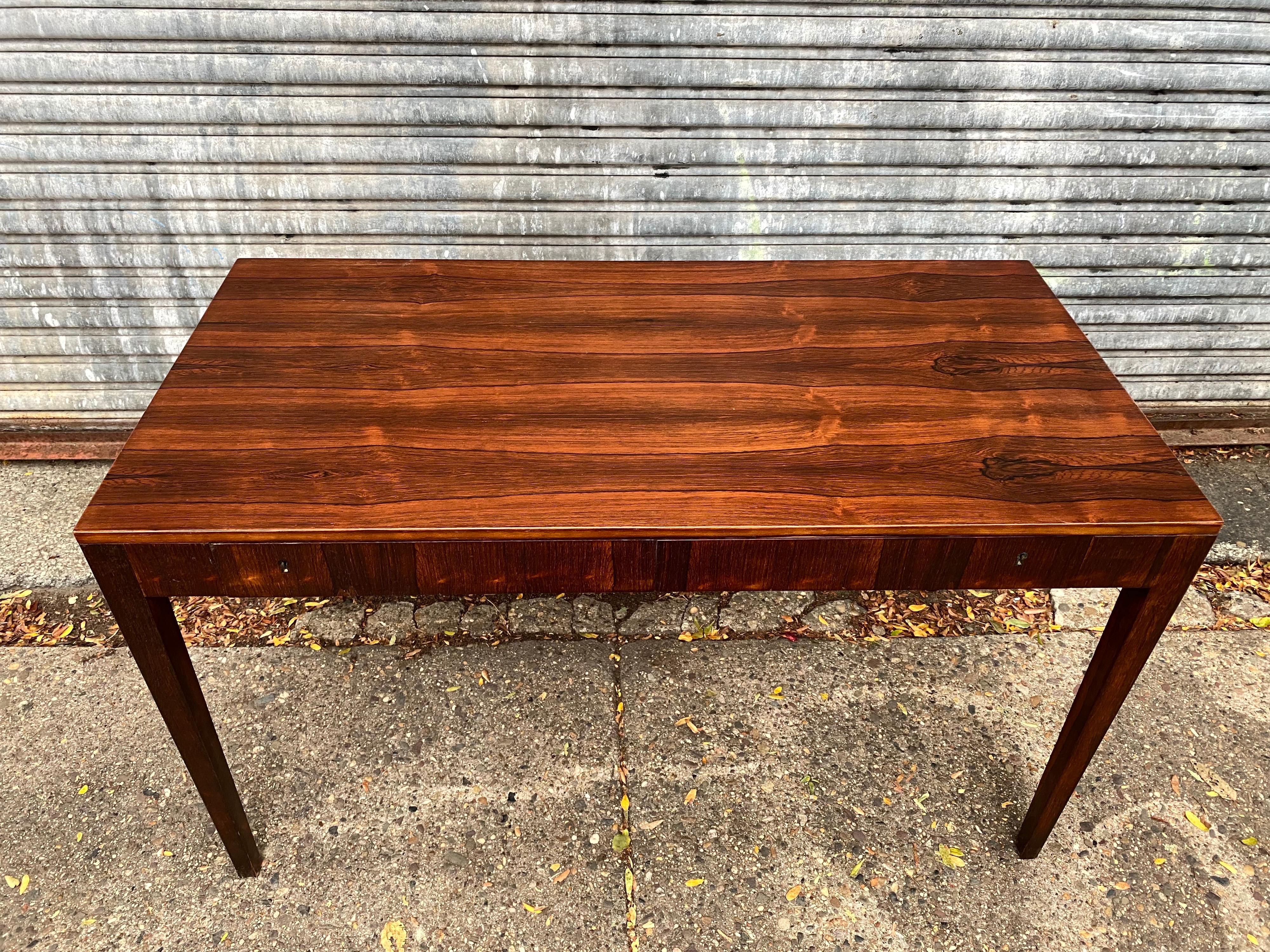 Riis Antonsen rosewood desk. Amazing Rosewood! Beautifully Refinished! 2 Large Drawers with locks, new key cut. Stamped on bottom of drawers as seen in photos. Simple elegant design!