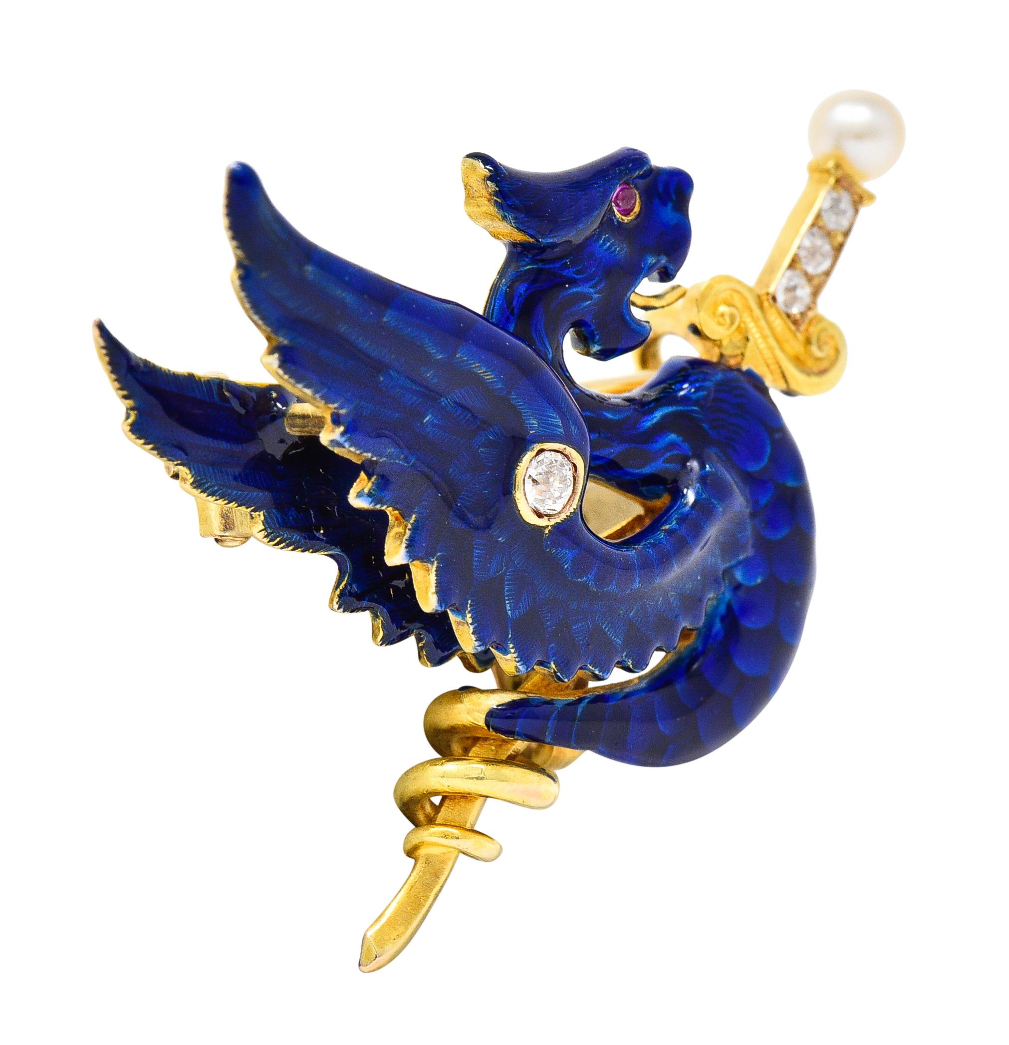 Designed as a winged wyvern serpent coiled around a sword with fanning wings
Featuring basse-taille enamel glossed over engraved feathers and scales
Glossy transparent royal blue in color - exhibiting minimal loss
Sword hilt and wing are accented by