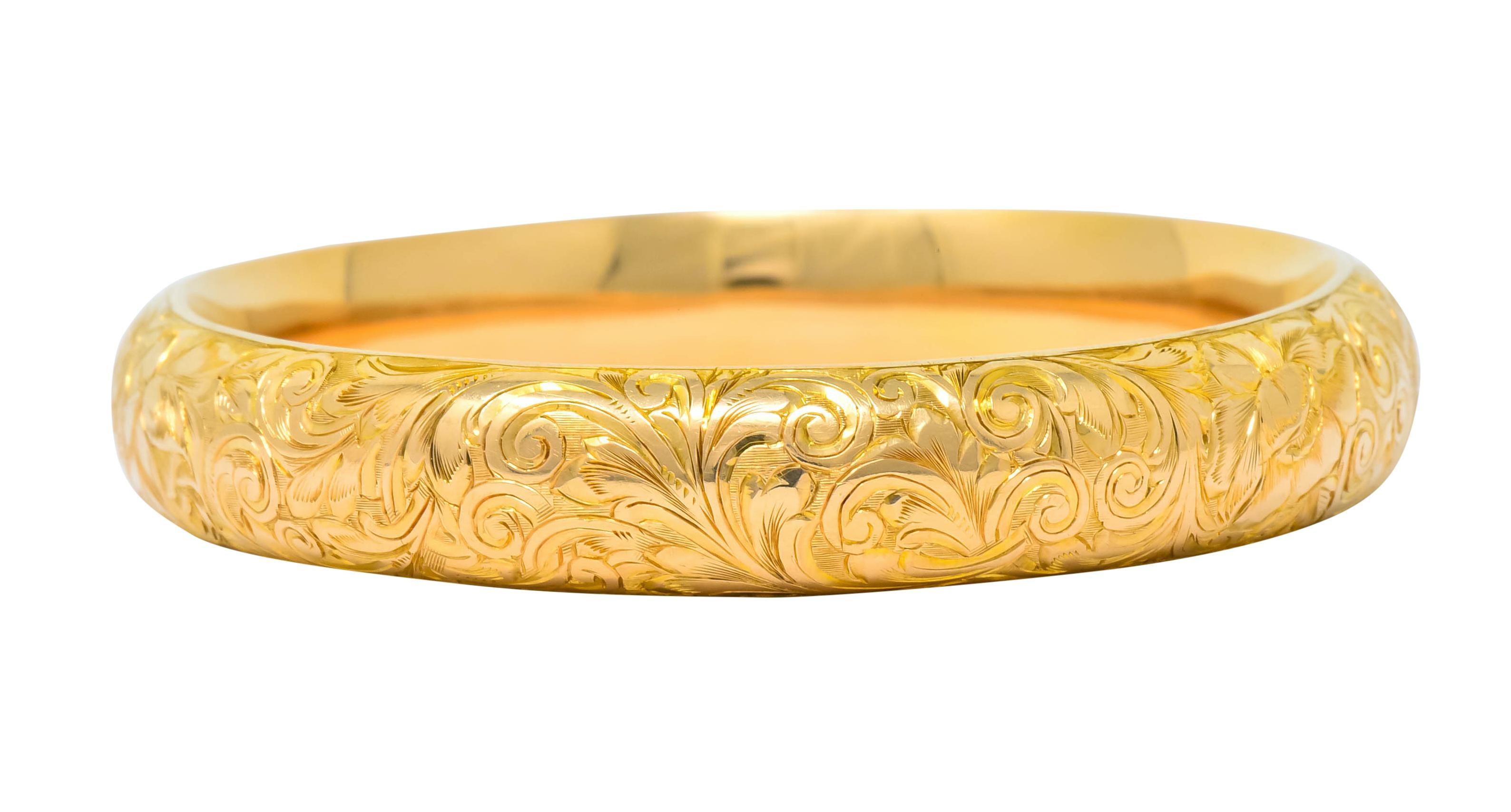 Designed as bangle style bracelet engraved with a blossoming foliate motif

With makers mark for Riker Brothers

Stamped 14k for 14 karat gold

Circa 1900

Inner circumference: 7 inches

Width: 1/2 inch

Total weight: 19.6 grams

Refined. Blooming.