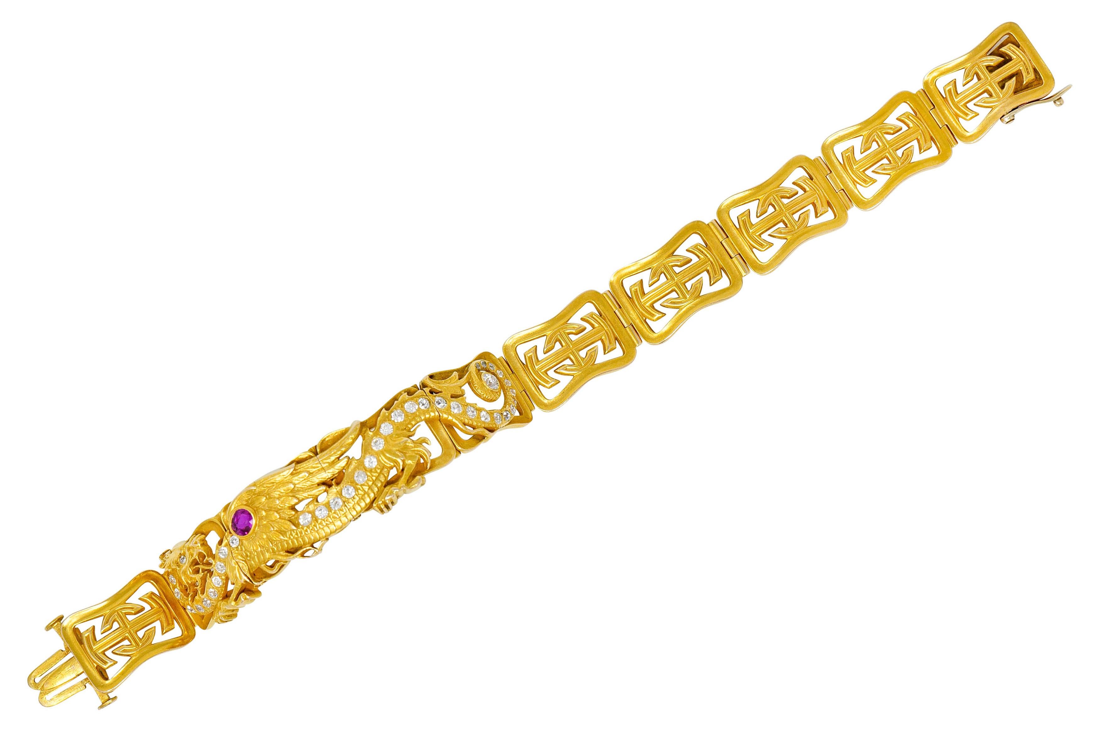 Bracelet is comprised of pierced geometric links that pivot on a hinge, and features a winged serpent dragon design with highly rendered feather and scale details

Dragon is lined with flush set old European cut diamonds weighing in total