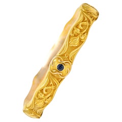 Antique Riker Brothers Art Nouveau Sapphire 14 Karat Yellow Gold Iris Bangle Bracelet
