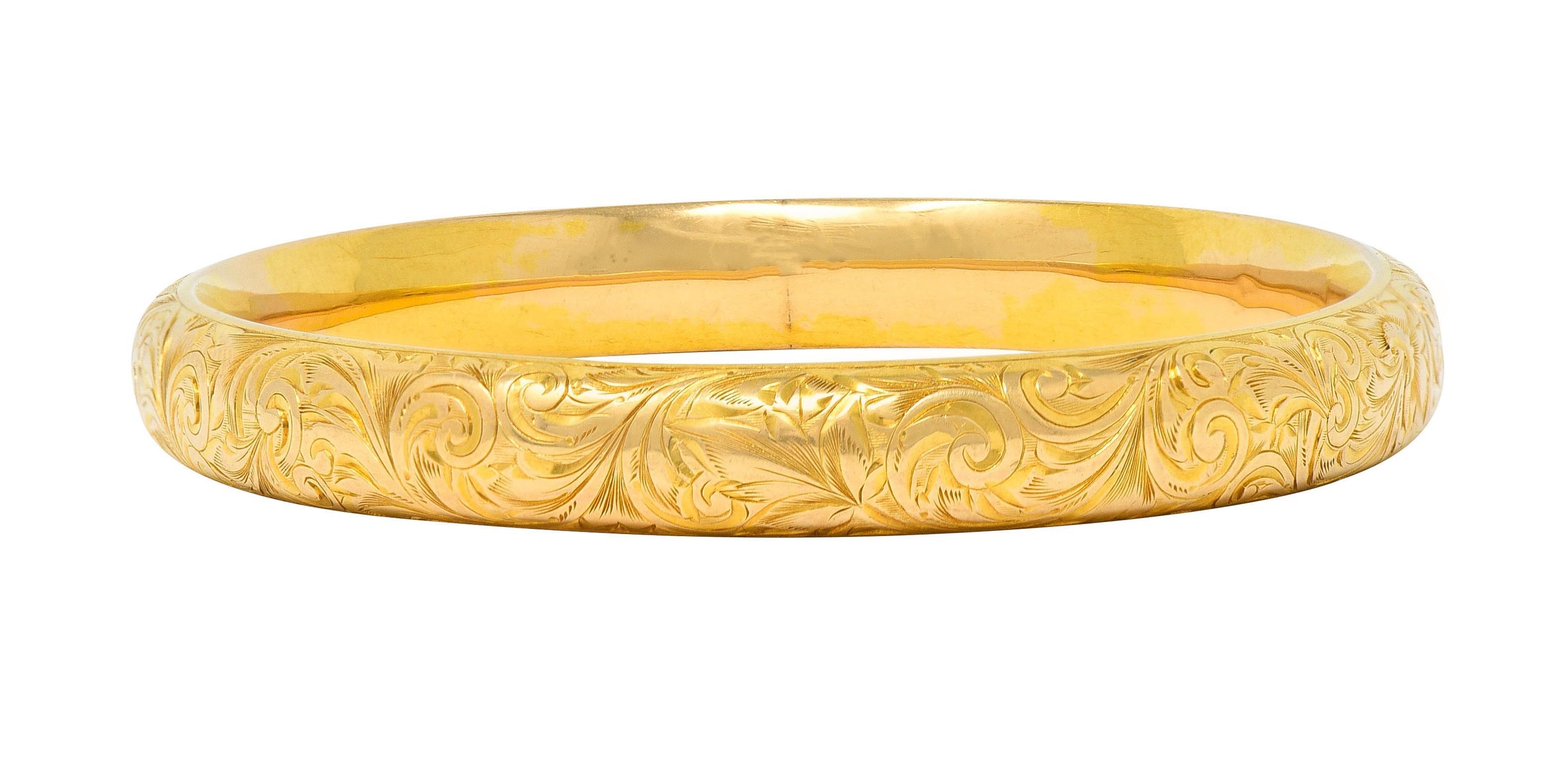 Designed as an oval-shaped bangle with a curved surface
Engraved with an ornate scroll motif throughout
With floral motifs and linear texture
Tested as 14 karat gold
With partial maker's mark for Riker Brothers
Circa: 1900
Width: 5/16 inch
Bracelet