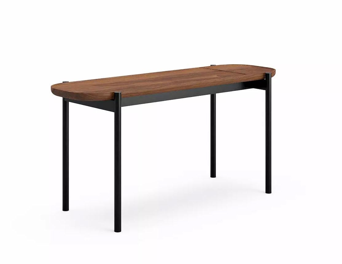 Riley over/side table by Dare Studio, 2018
Dimensions: H 36 x D 26 x W 75 cm
Materials: American black walnut, powder-coated frame in black RAL 9005

Also available in European white oak with black stain and wax oiled finish.

Dare Studio is a