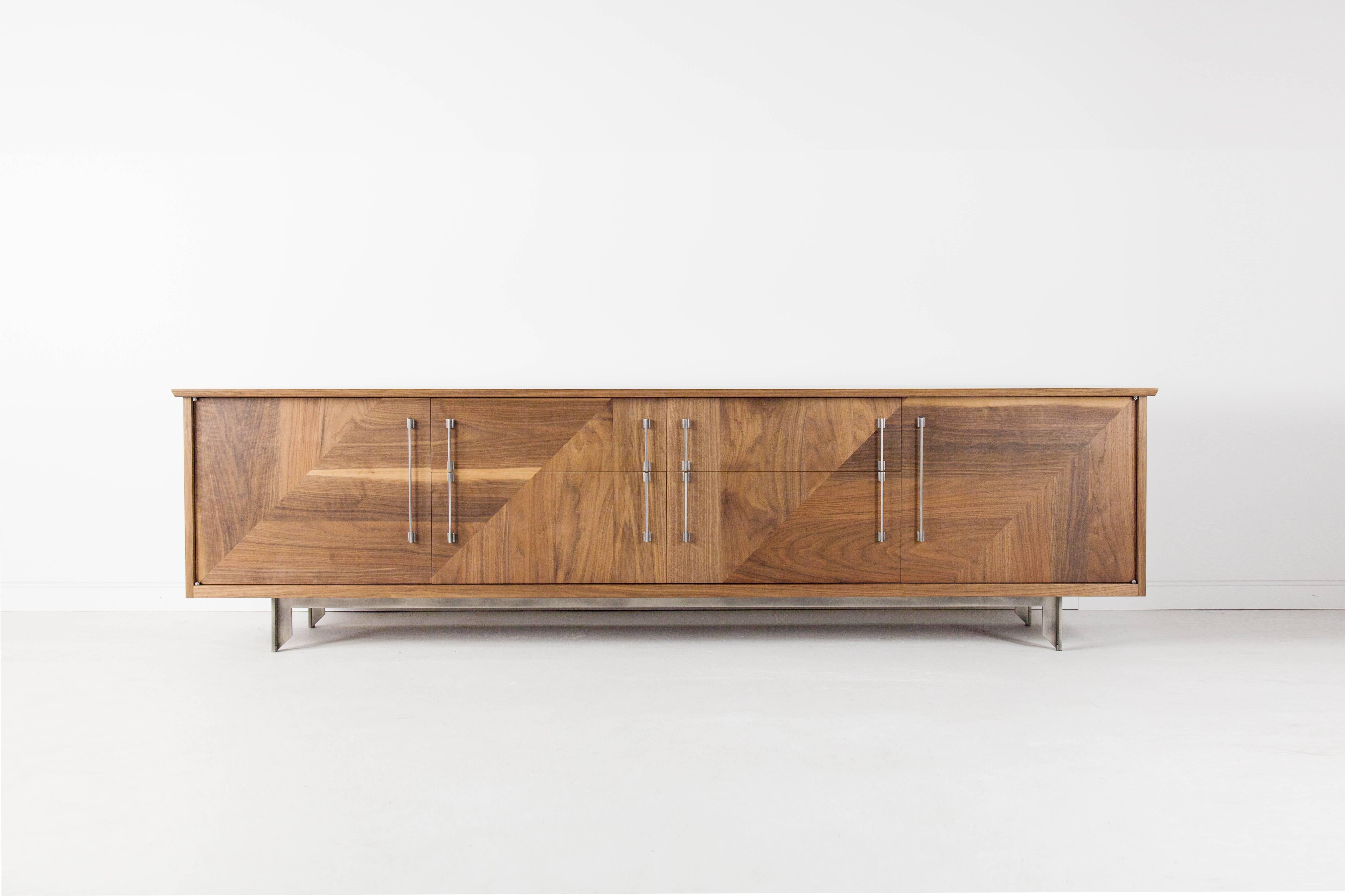The traditional form of the Riley Sideboard frames the patterned imagery held by the doors and drawer fronts. The sideboard has studio-machined hardware and hand-patterned woodwork, as well as soft close drawers and adjustable shelves. Each piece is