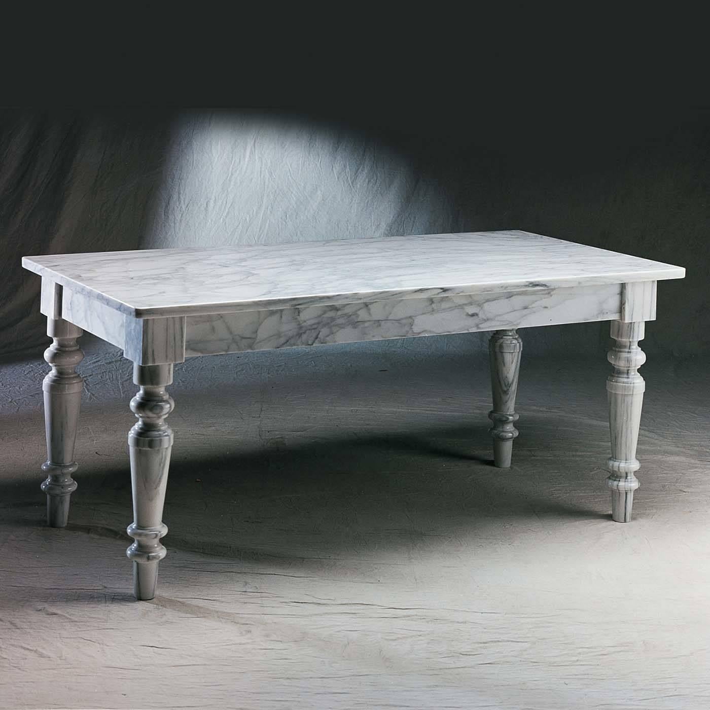 Inspired by the 19th century antique partners desk, this monochromatic single-material marble table is reinterpreted as a dining table offering ample room with a long top and tapering, fluted legs that add expansiveness to this luxurious piece. In