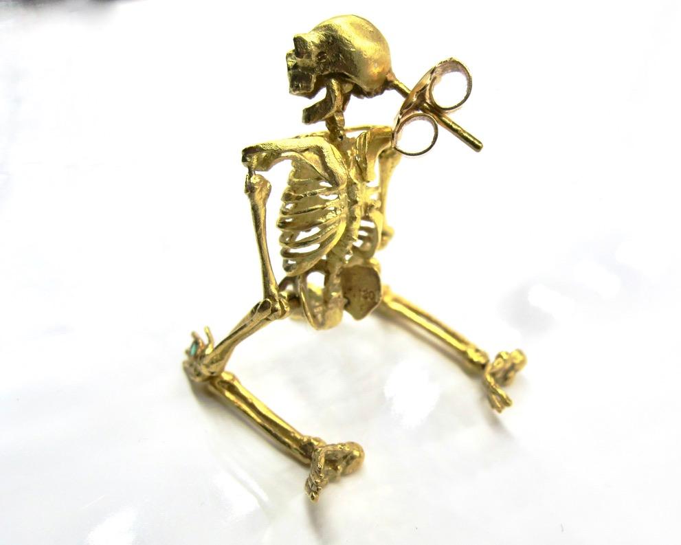 This single earring's 16 individual parts were sculpted in wax and cast individually in solid 20k then assembled with meticulous care to create this jaunty skeleton: unrivaled in its naturalistic movement and artistic sensibility. 

RIMA JEWELS'