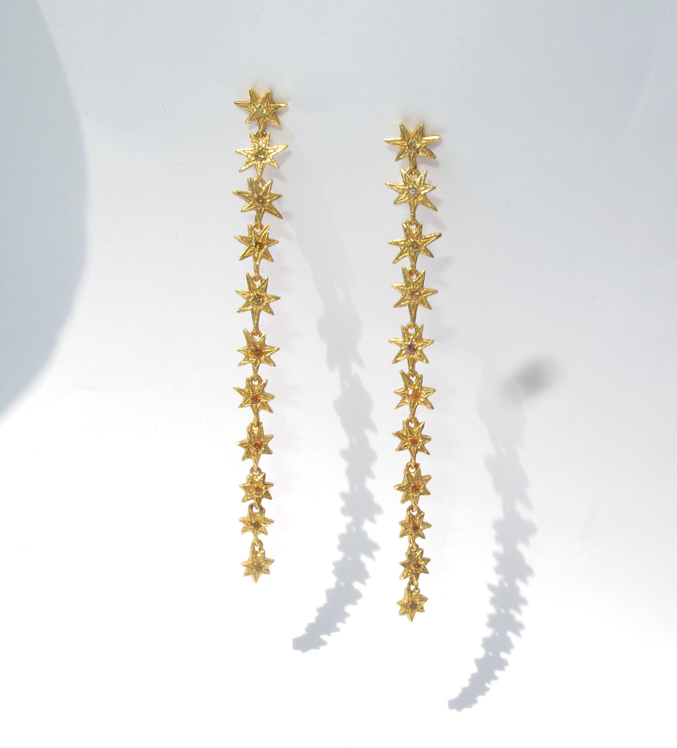 This 22k gold earring set features twenty two of RIMA’s signature seven pointed stars which have been set with full brilliant cut yellow-marigold diamonds (ranging in size from 1.65mm 1.3mm in diameter). The star drop earrings feature precisely 22,