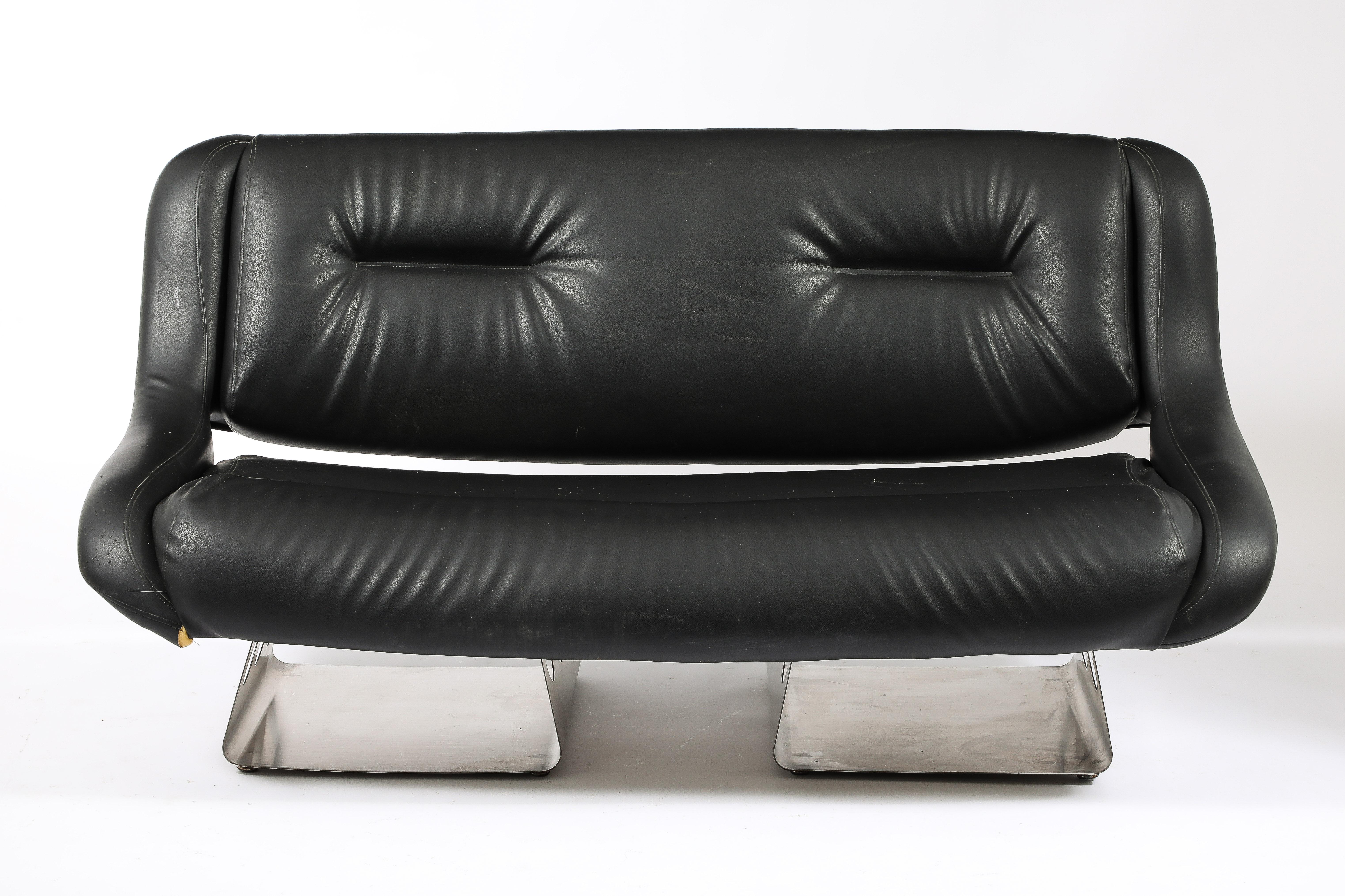 Bent brushed stainless steel settee by Rima with original upholstery, metal is in exceptional condition.
