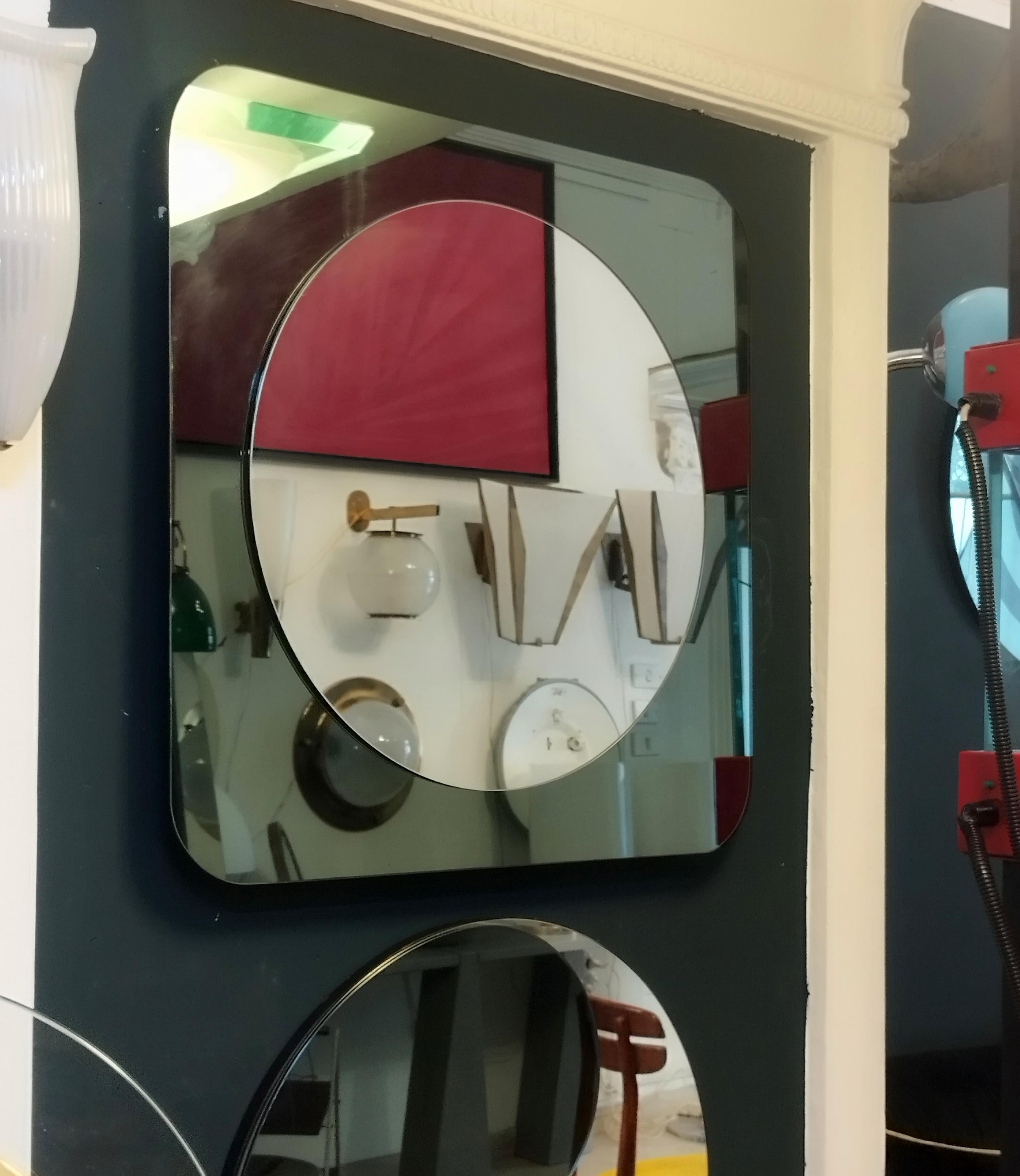 Very rare square mirror manufactured by Rimadesio 1970s. Green colored mirrored glass frame. 
Item is in excellent conservative condition, no aesthetic or structural defects to report, only slight and obvious signs of time present.
