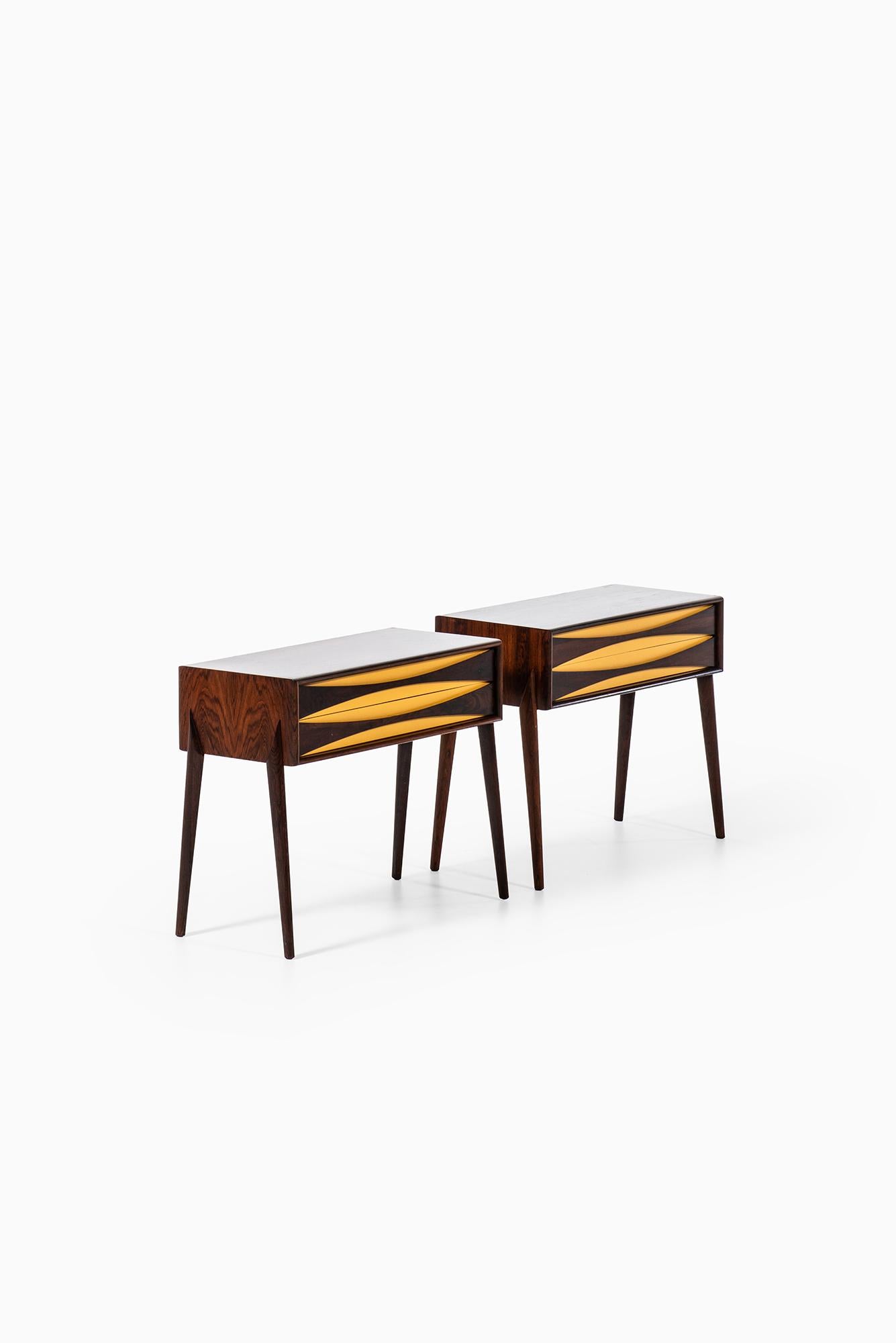 Rare pair of side tables / bedside tables designed by Rimbert Sandholt. Produced by Glas & Trä Hovmantorp in Sweden.