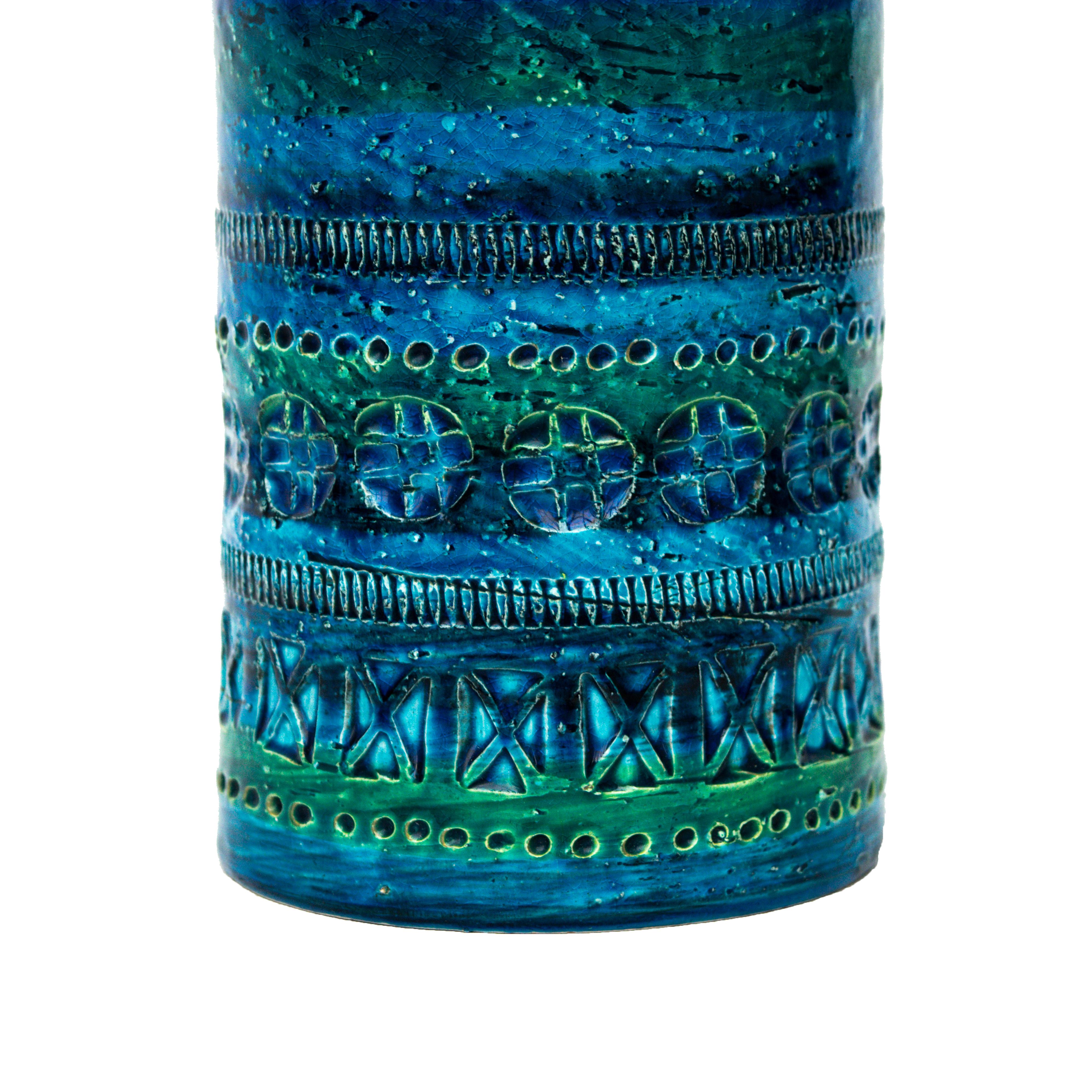This vase was thrown and embossed by hand. The piece has been painted by hand with the classical Rimini blue shiny transparent glaze.