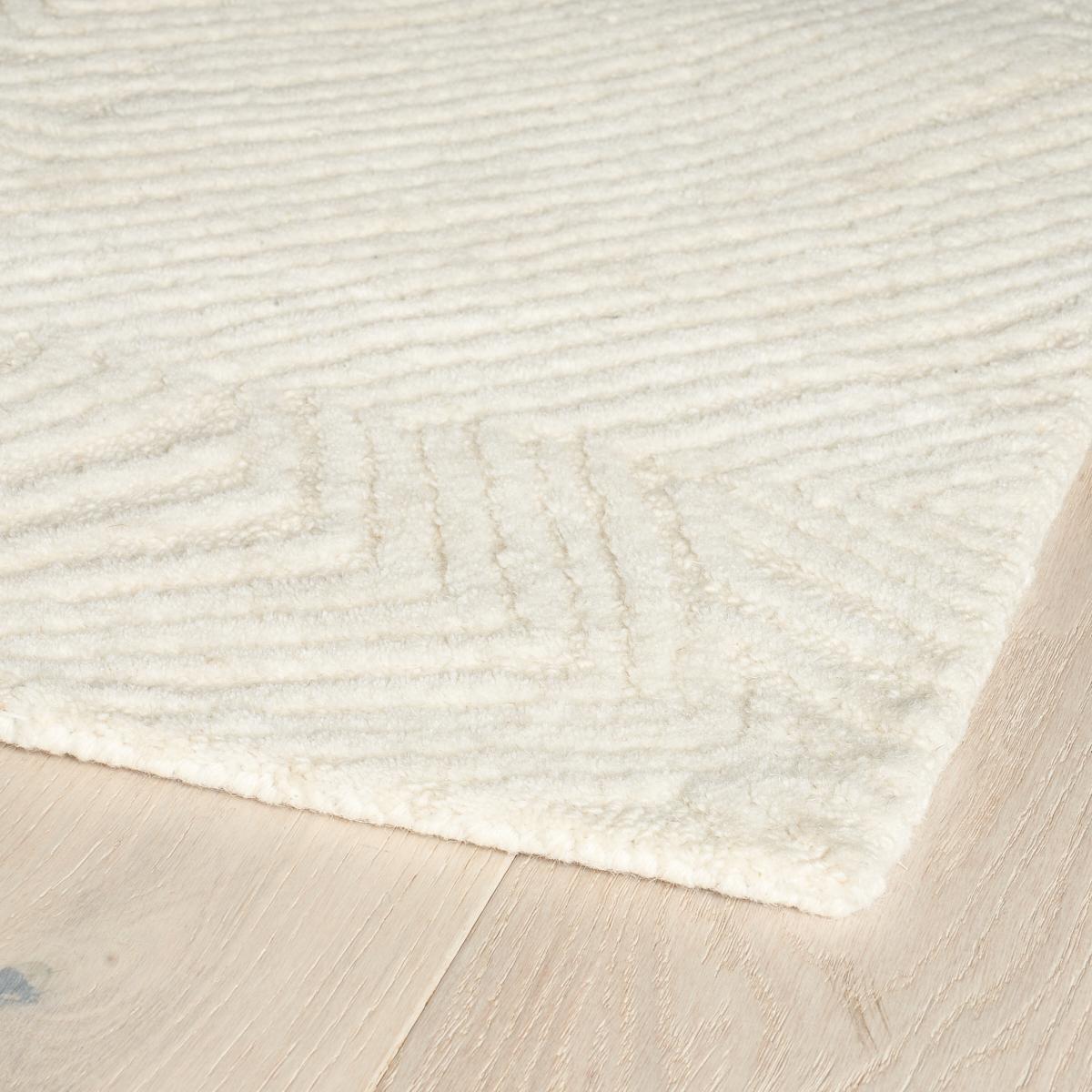Hand tufted and made of 100% wool, Rimini has loop and cut pile construction that forms an intricate, topographical design. With its extraordinary texture and refined border detail, this rug is soft and subtle yet modern and graphic.