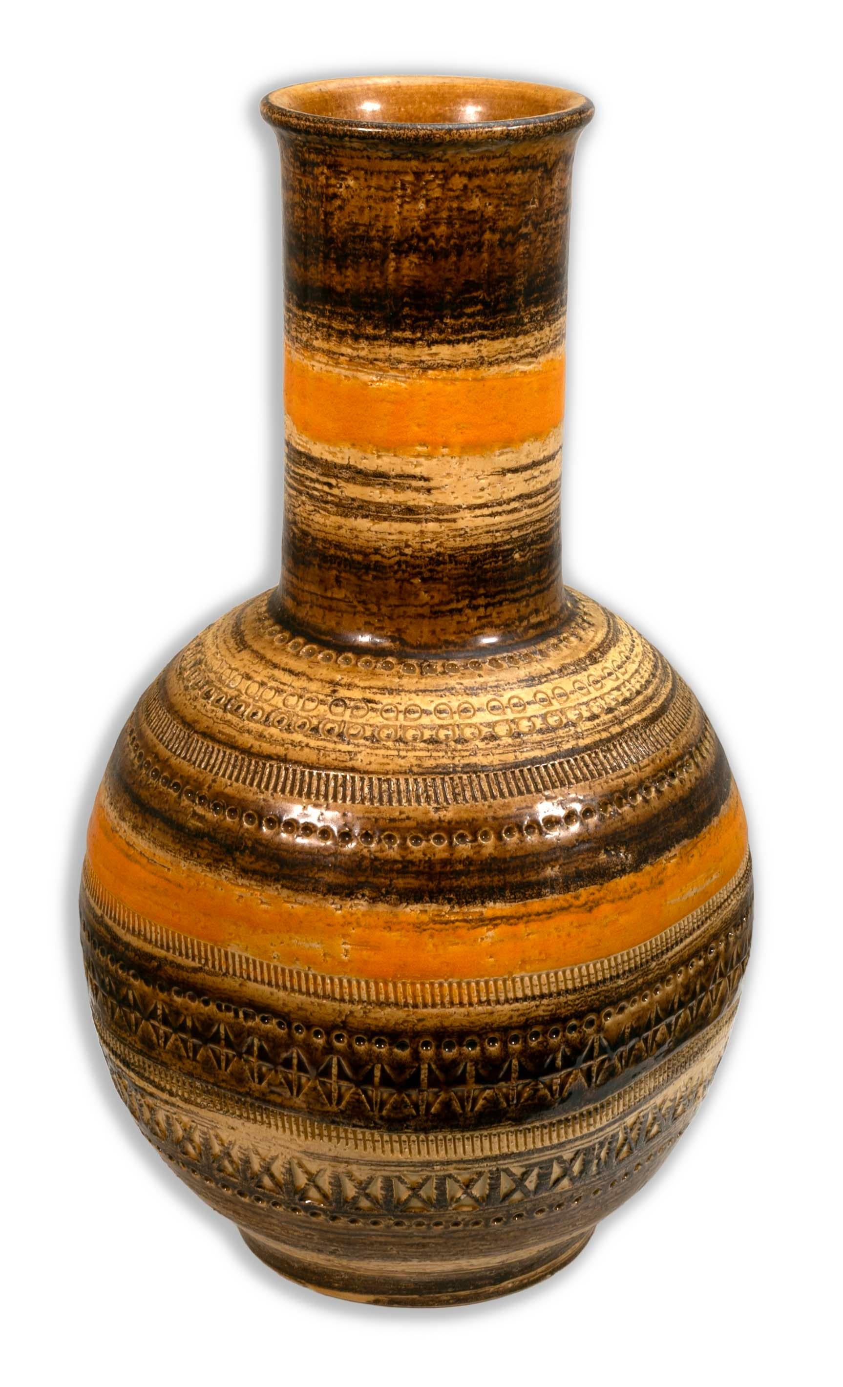 Exquisite Rimini Sahara Bitossi Vase for Raymor. This mid-century modern masterpiece showcases a harmonious blend of earthy browns and vibrant orange, highlighted by intricate patterns that add texture and depth. Renowned for their high-quality