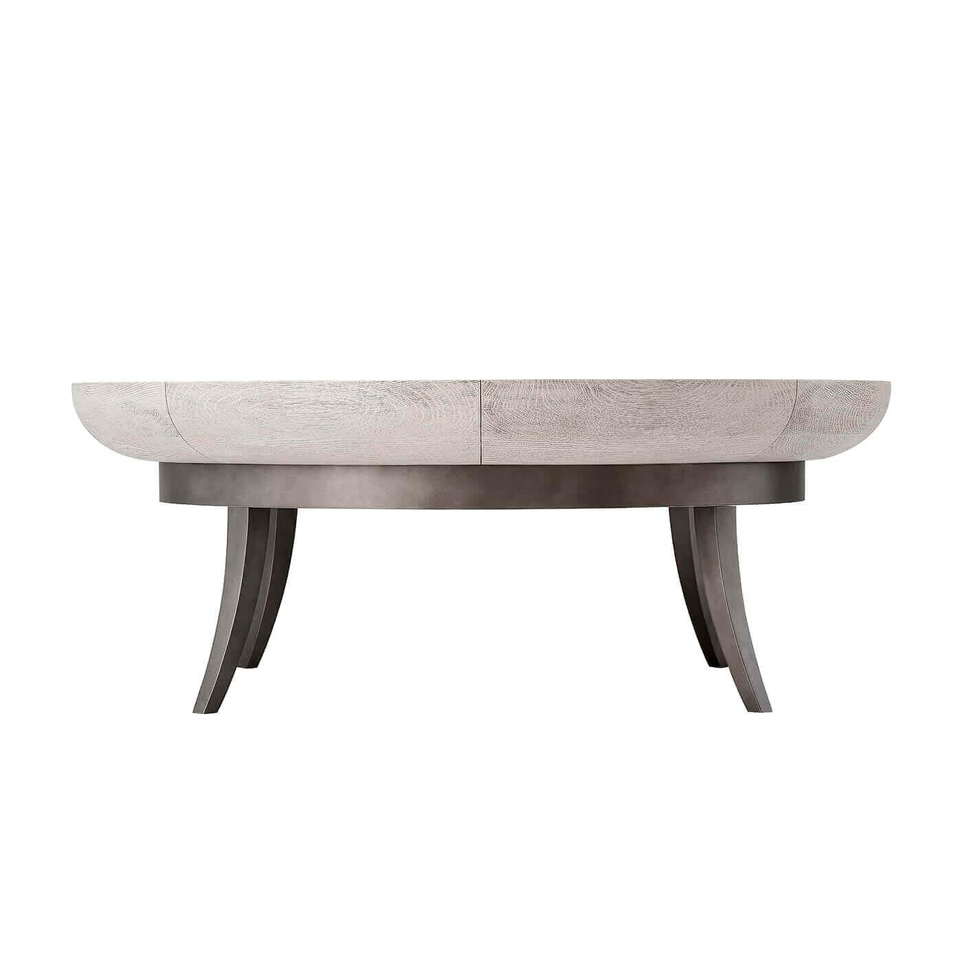 A rimmed bowl top coffee table with splayed sabre legs. This table has a beautiful circular rimmed bowl top in a 