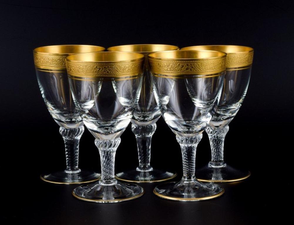 Rimpler Kristall, Zwiesel, Germany, five hand-blown crystal white wine glasses with gold rim decorated with grapes and vine leaves.
1960s.
In perfect condition.
Dimensions: H 12.2 x D 7.0 cm.