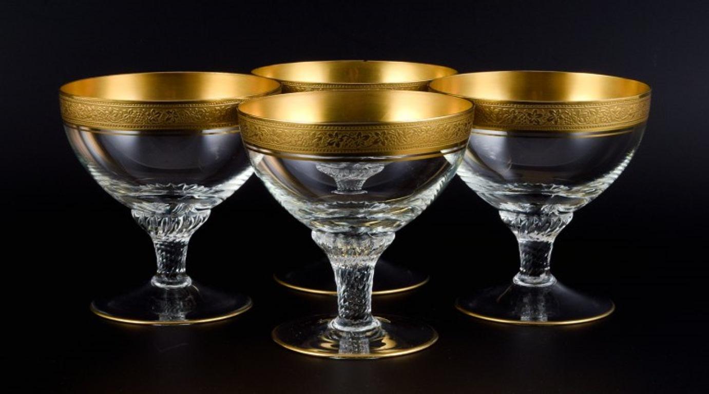 Rimpler Kristall, Zwiesel, Germany, four mouth-blown crystal champagne glasses with gold rim decorated with grapes and vine leaves.
1960s.
In perfect condition.
Dimensions: H 10.5 x 10.0 cm.