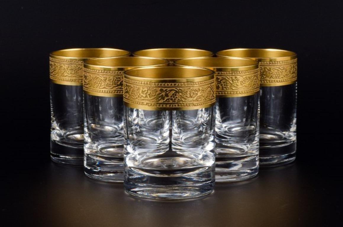 Rimpler Kristall, Zwiesel, Germany, six mouth-blown crystal shot glasses with gold rim decorated with grapes and vine leaves.
Mid-20th century.
In perfect condition.
Dimensions: H 6.0 x D 4.5 cm.