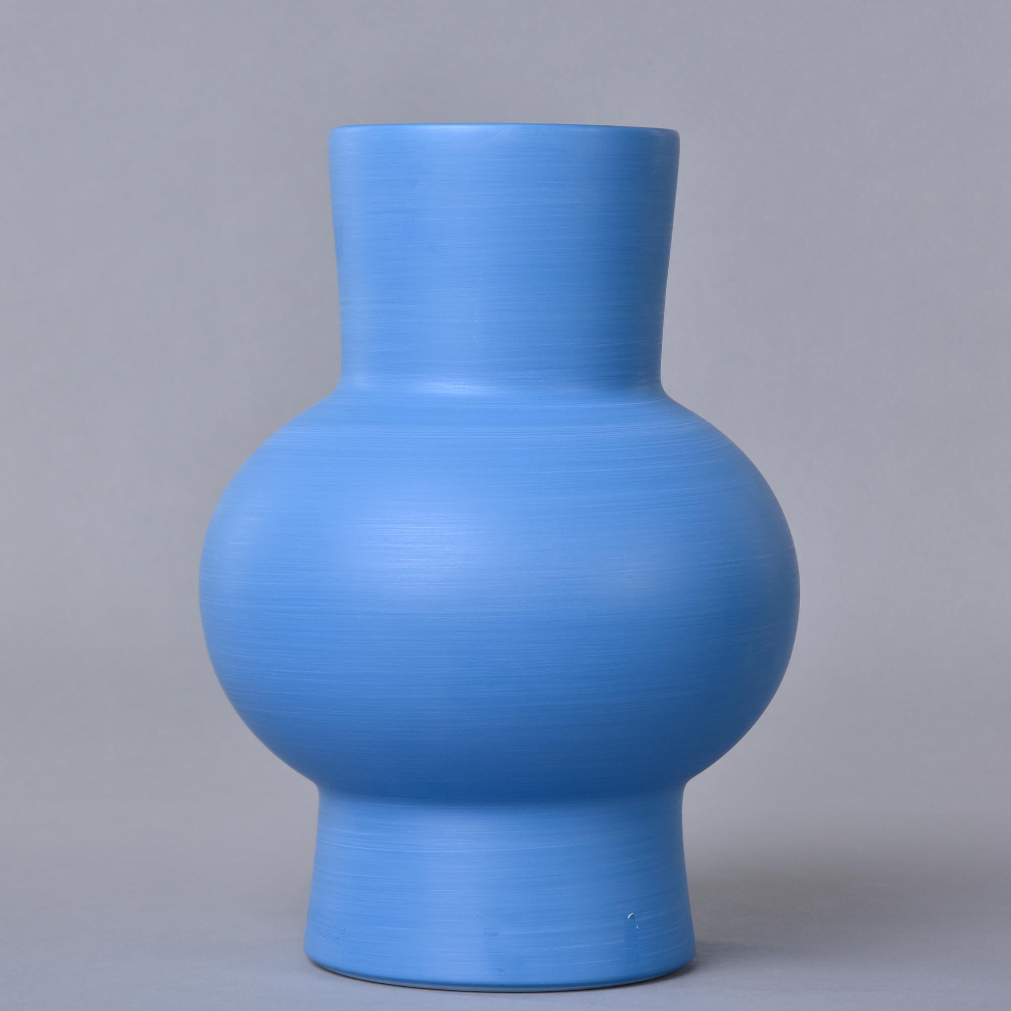 New and made in Italy by Rina Menardi, this thin-walled vase stands over 12” high and has a pleasing shape. The cornflower blue colored glaze has a contrasting dark washed interior. Signed on underside of base. New with no flaws found. Other colors,