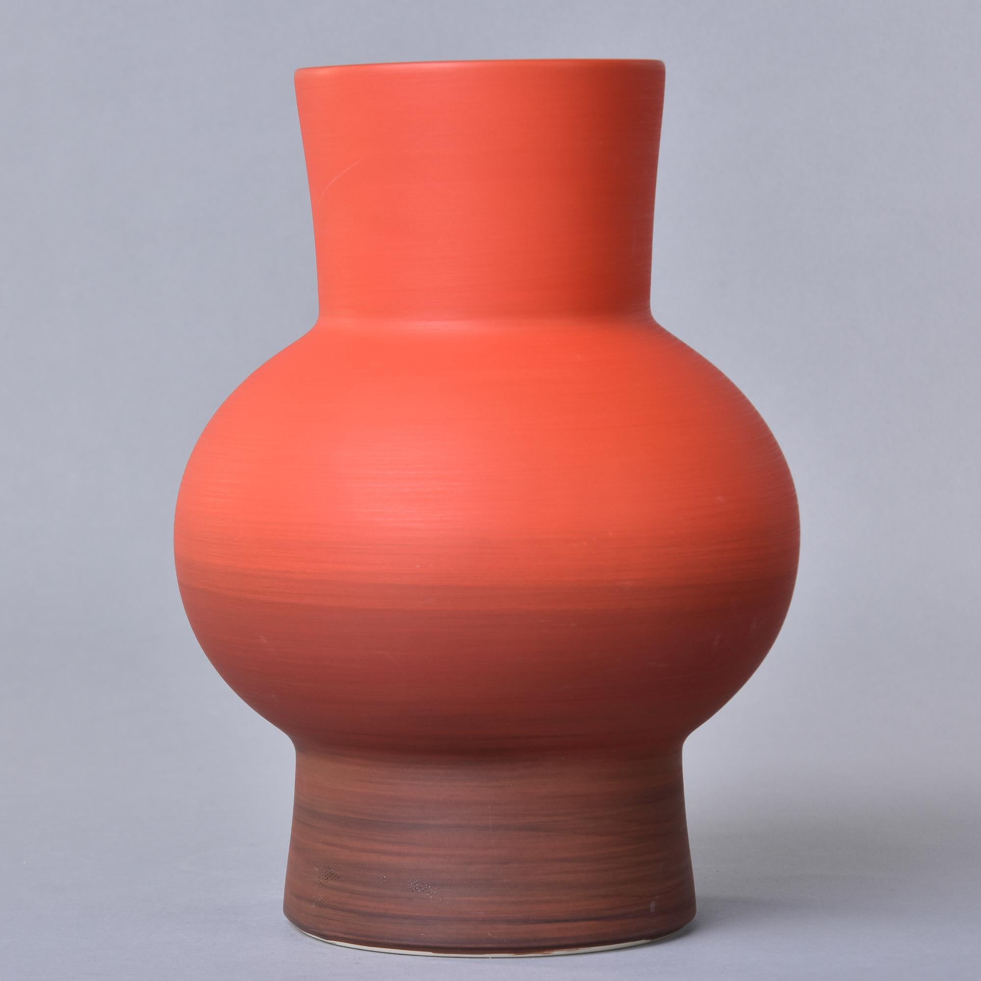 New and made in Italy by Rina Menardi, this thin-walled vase stands over 12” high and has a pleasing shape. The ombre-style poppy red colored glaze has a contrasting dark washed interior. Signed on underside of base. New with no flaws found. Other