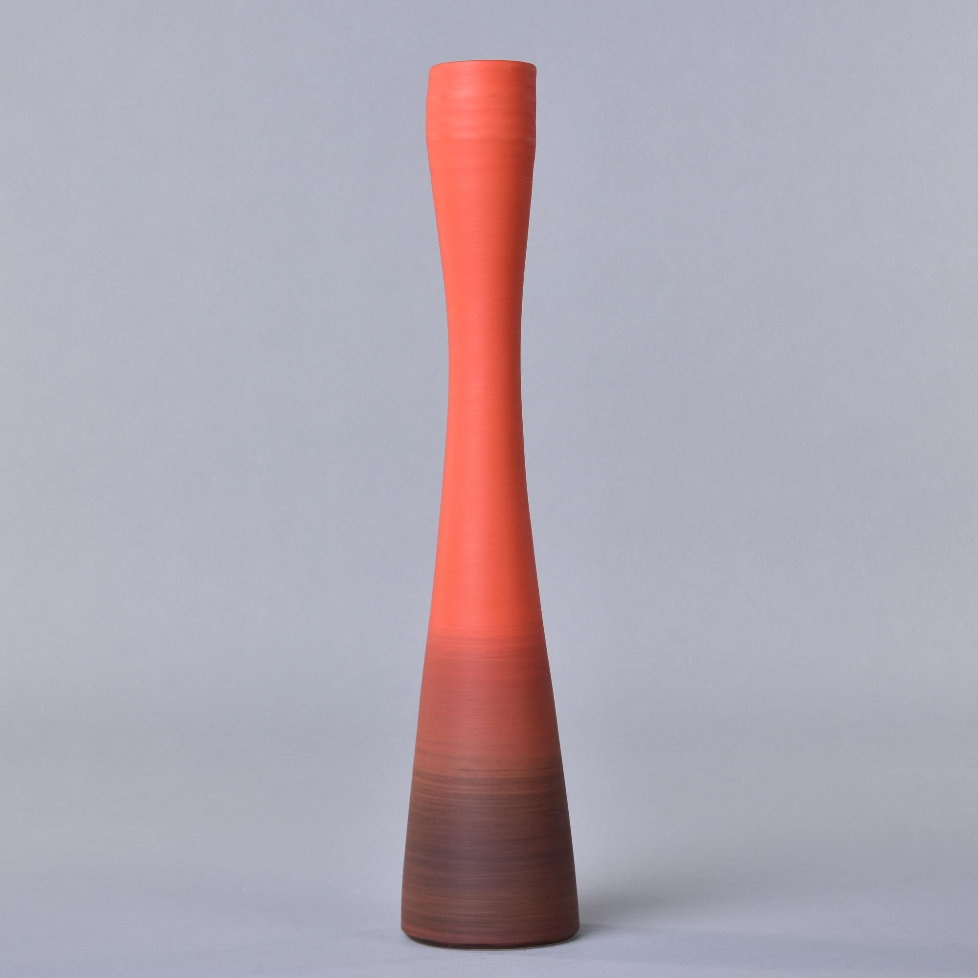 New and made in Italy by Rina Menardi, this tall slender vase is 18” high and has an ombre style red glaze. Inside has a contrasting soft black wash. Other colors and shapes from this maker available.