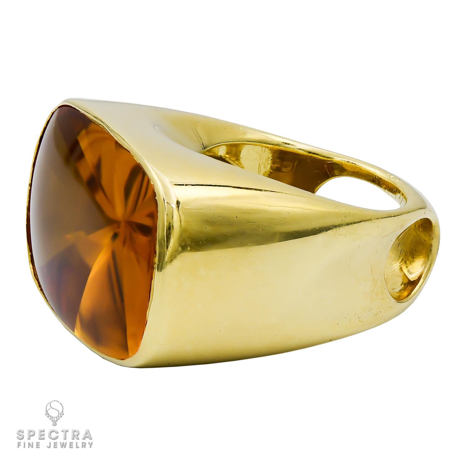 A beautiful cocktail ring made in 18kt yellow gold by Rinaldo Gavello.
The center stone is a rectangular citrine weighing a total of approximately 40 carats.
Gross weight 34.1 grams.
Size 7. Resizing available depending on size.