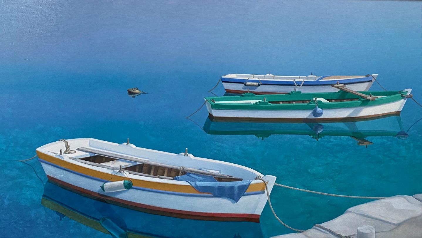 Three enchanting dories at anchor await the foot steps along the sun drenched stone walkway that will determine their activity on that sun drenched morning or even, perhaps, for a week of fishing by just the men.  The unbelievably clear turquoise
