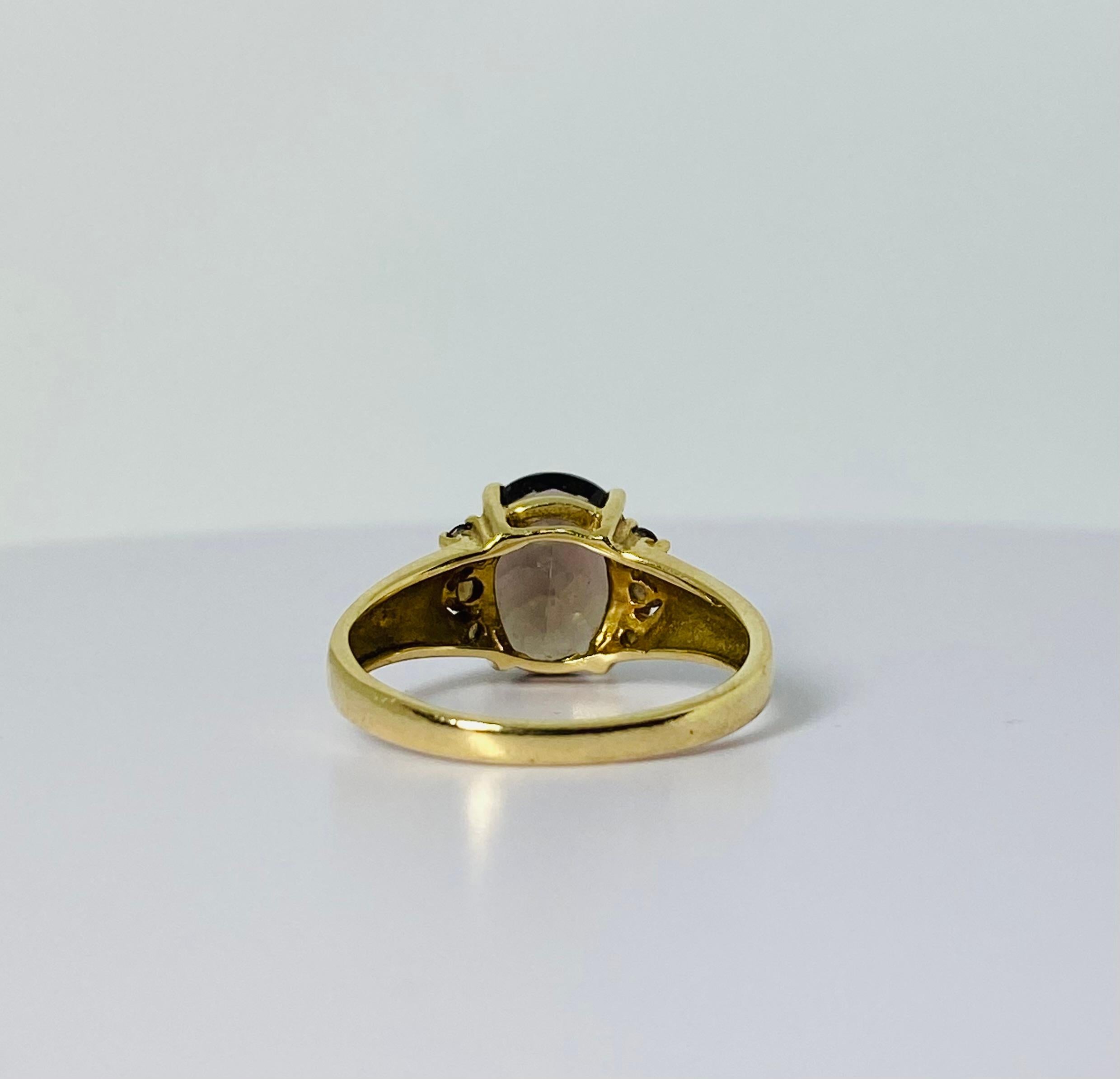 14 carat gold ring with oval 2 carat smoky quartz  2 carat and 6 smokey quarts 1