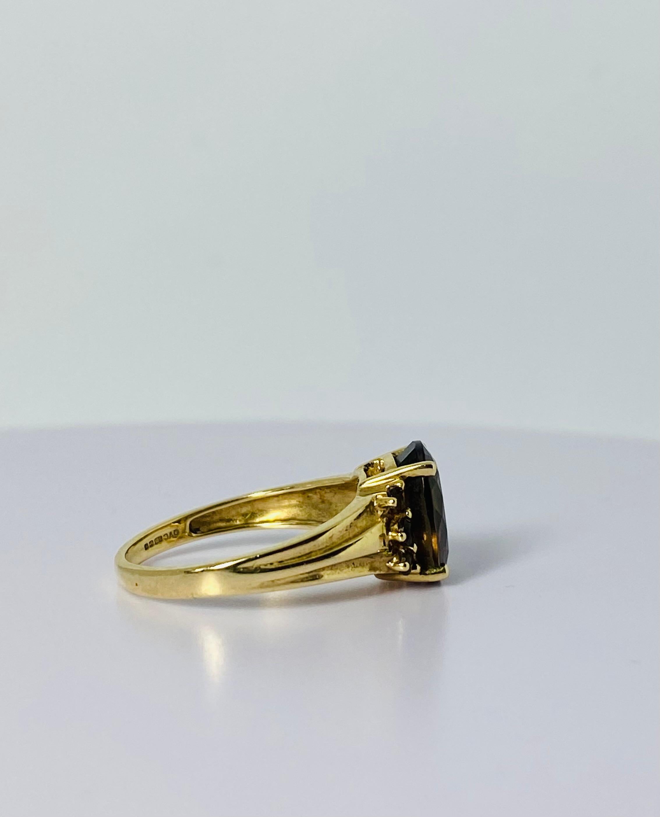 14 carat gold ring with oval 2 carat smoky quartz  2 carat and 6 smokey quarts 2