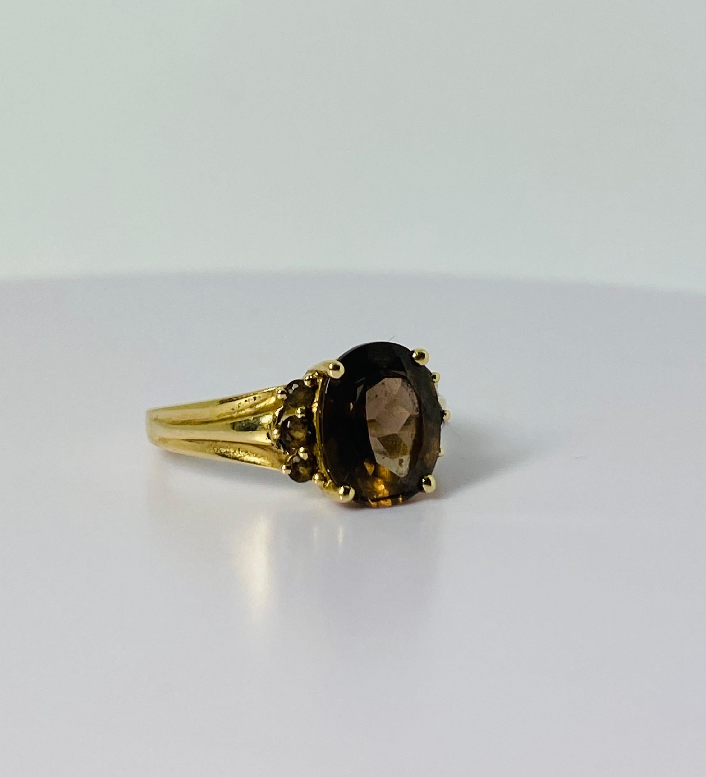 14 carat gold ring with oval 2 carat smoky quartz  2 carat and 6 smokey quarts 3