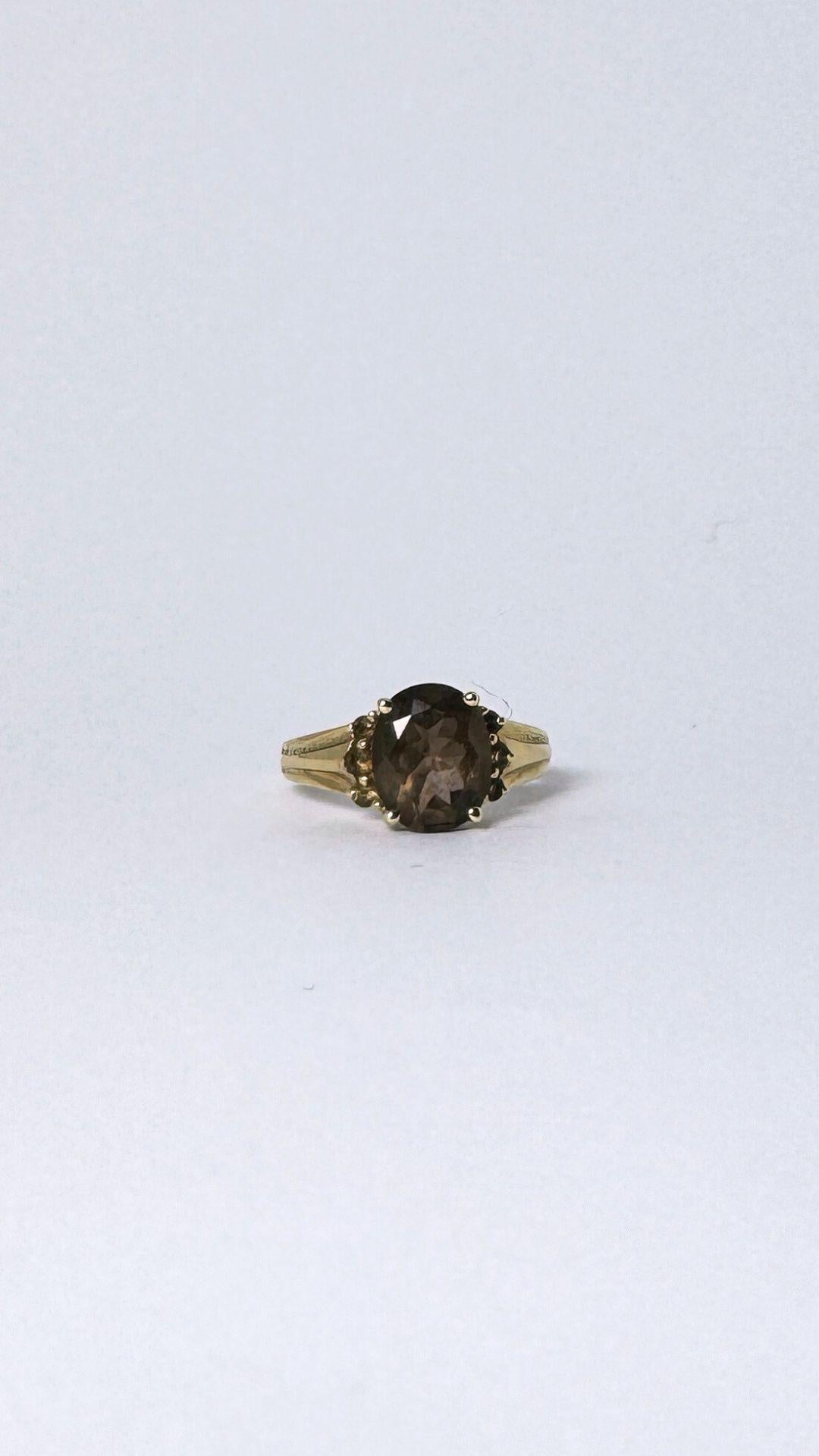 Post-War Ring 14 carat gold with smokey quarts  2 carat, surrounded with little quarts  For Sale