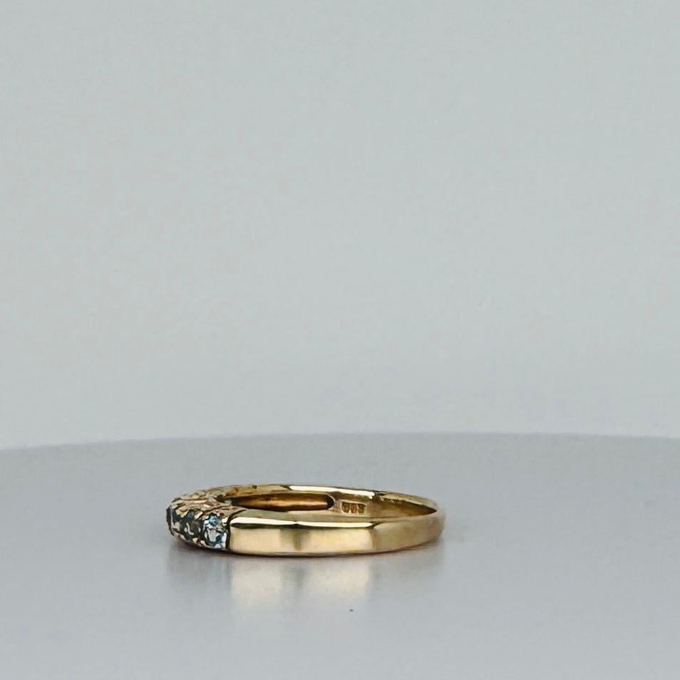 Women's Ring 14 carat yellow gold with 7 round cut aquamarines