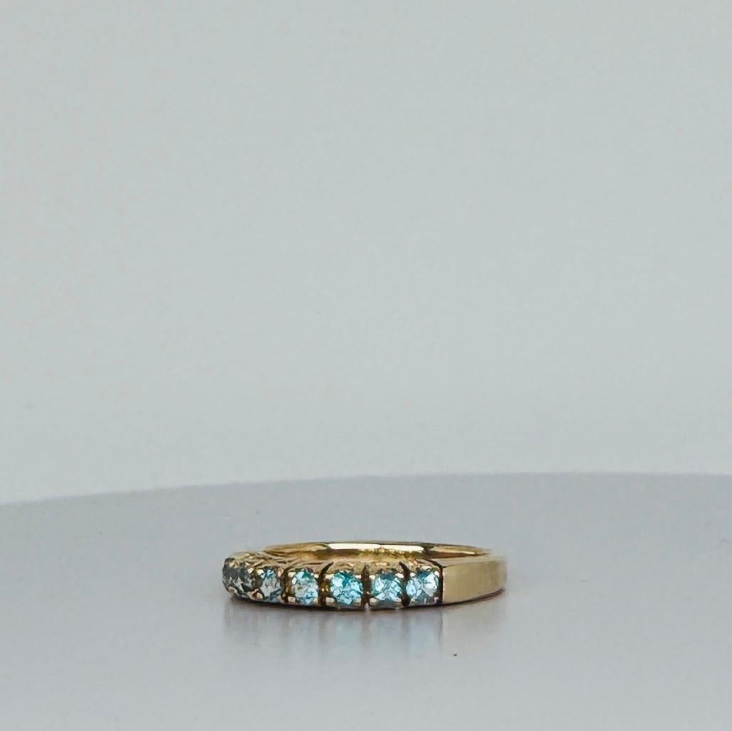 Ring 14 carat yellow gold with 7 round cut aquamarines 1