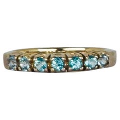 Ring 14 carat yellow gold with 7 round cut aquamarines