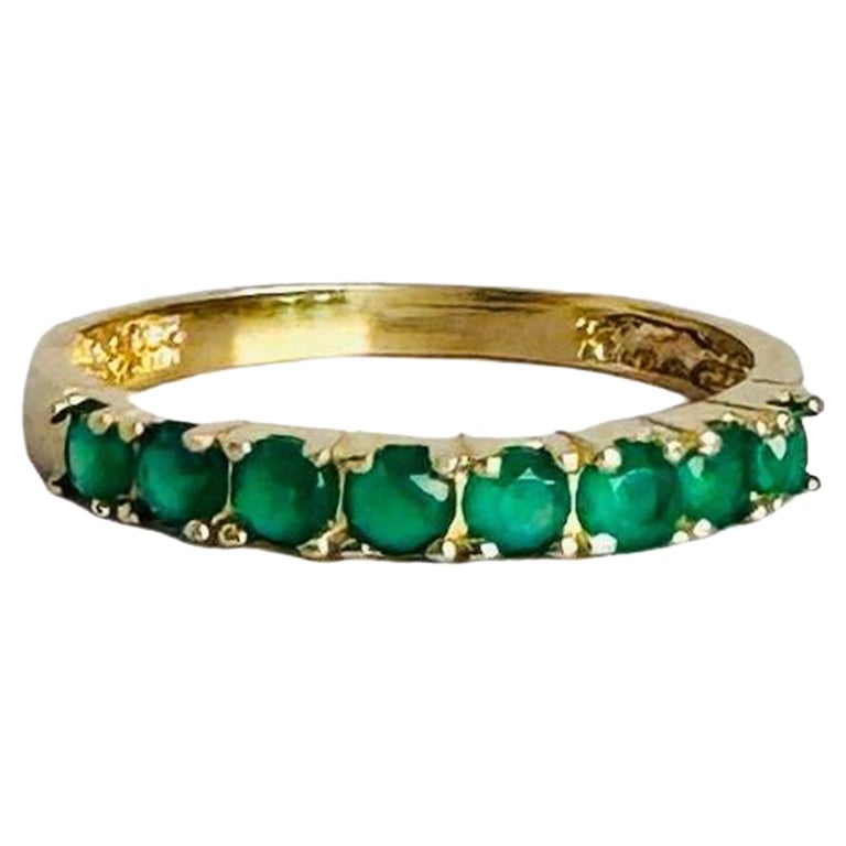 Bague demi-éternité en or jaune 14 carats avec émeraudes 0,24 carat