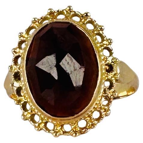 Ring 14k Yellow Gold with Oval Facetted Garnet of 2.5 carat For Sale