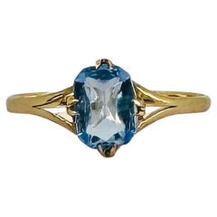 Bague en or jaune 14k avec topaze bleue ovale 1,5 carat
