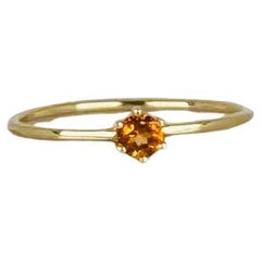 Bague en or jaune 14 carats avec topaze jaune à facettes rondes