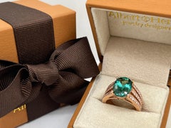 Bague en or 14 carats, tourmaline verte ovale 4,52 carats et diamants 0,63 carat Tige fendue