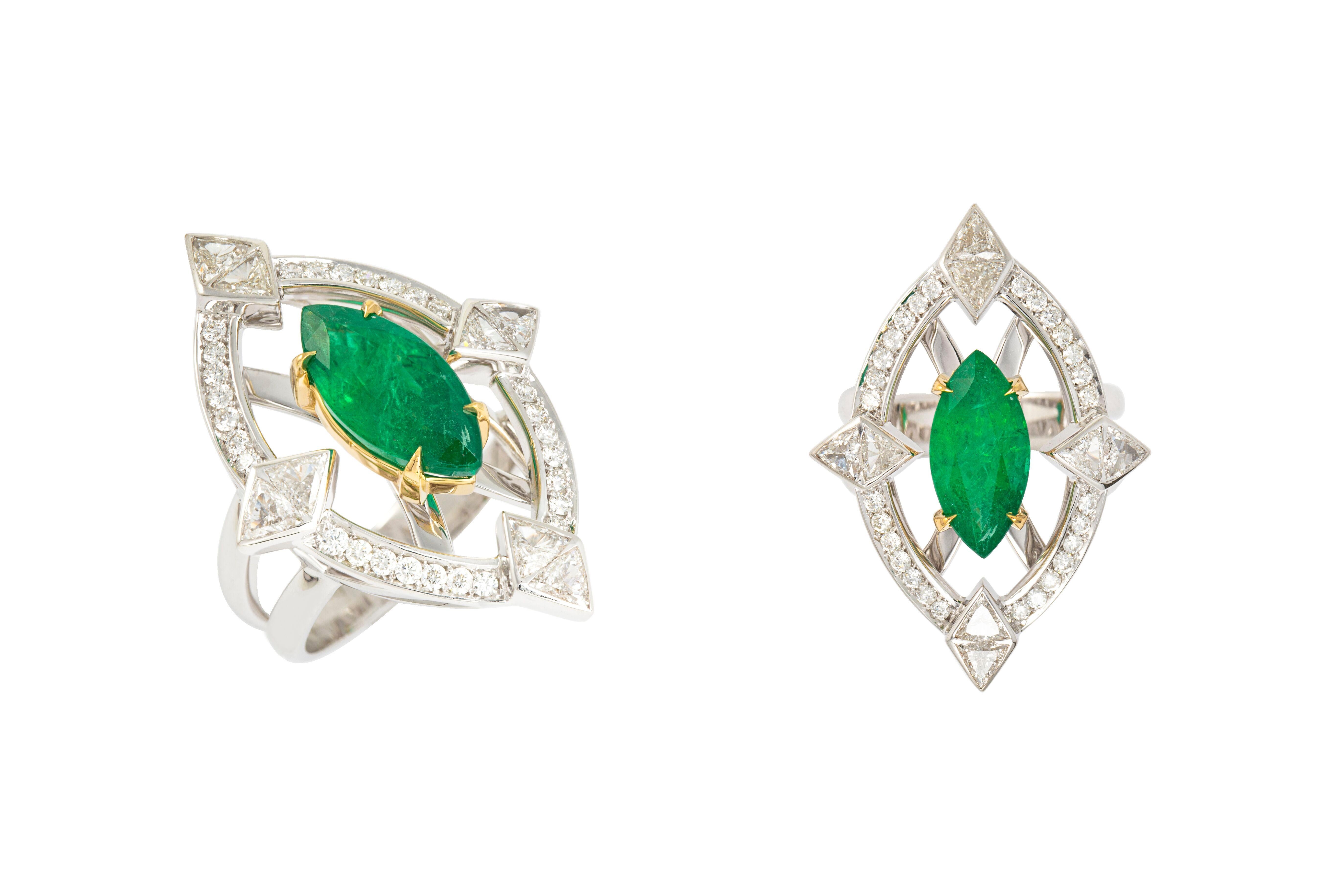 Designed exclusively by Ara Vartanian, this 18k White & Yellow Gold ring features one Emerald in a marquise faceted cut, weighing 3,19ct (three carats and nineteen points), along with eight White Diamonds in trillion brilliant cut, with a total