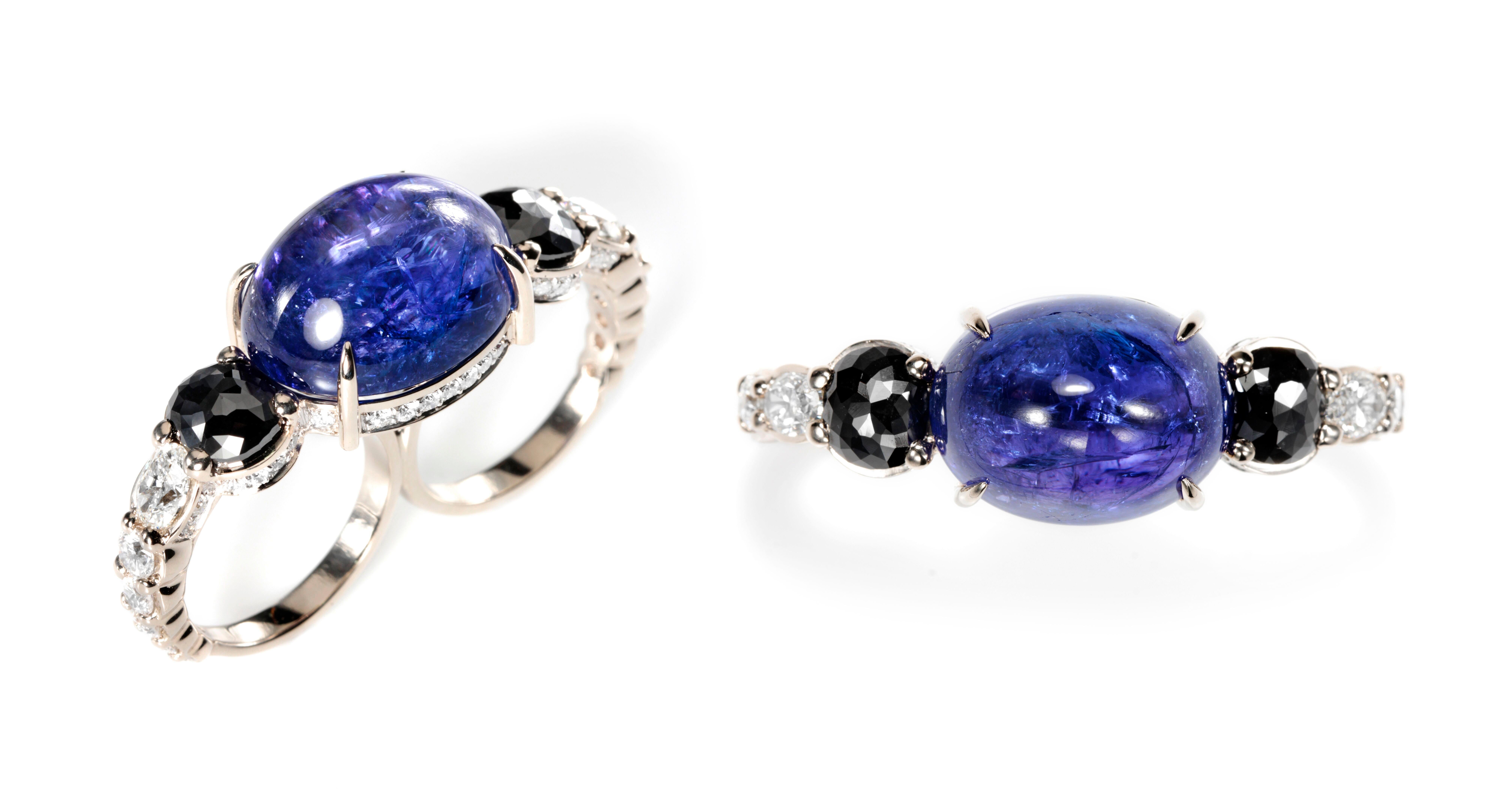 Designed exclusively by Ara Vartanian, this 18K White Gold two finger ring features one Tanzanite, in a oval cabochon cut, weighing 30,3ct (thirty carats and three points), along with a pair of Black Diamonds in a antique rose-cut, with a total