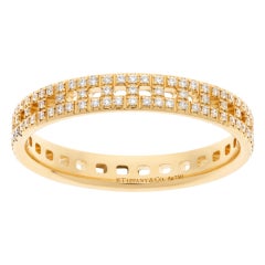 Ring 18k rose gold with diamonds.  Tiffany & Co. True T Narrow