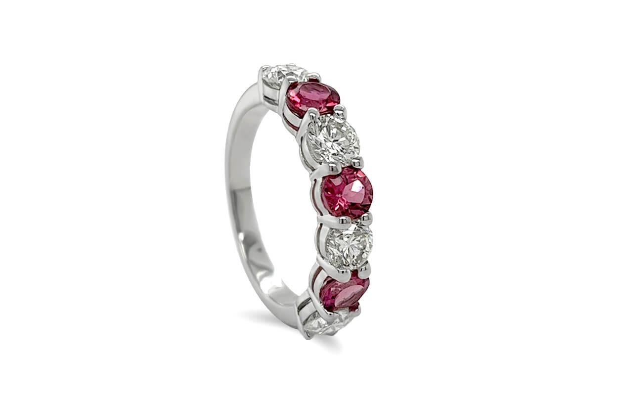 Behold the Half Ring, a symphony of color and sparkle in a luxurious 18kt setting. This exquisite piece features a row of tourmalines, each gemstone displaying its unique and vibrant hue, like nature's own palette. Set delicately in prong settings,