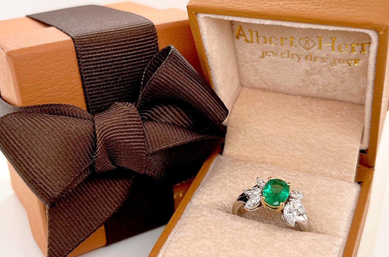 This GIA certified Emerald ring features a stunning emerald set in 18kt. gold. The design is accentuated by marquise-cut diamonds on the sides adding elegance and brilliance to the overall look. The GIA certification guarantees the authenticity and