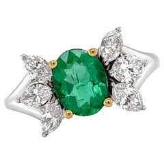 Ring 18kt Gold Majestic GIA Oval Emerald 0.98 cts & Marquise Diamonds 0.83 cts.